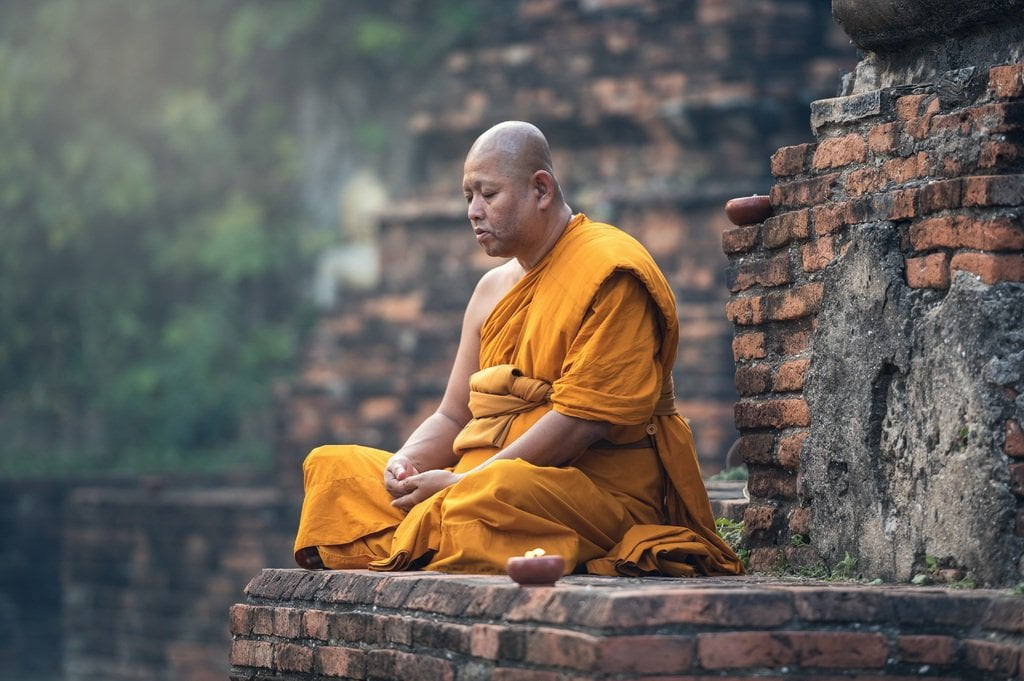 Surprising Benefits of Meditation on Brain Health 1 walking person people seat contemplation orange 1026349